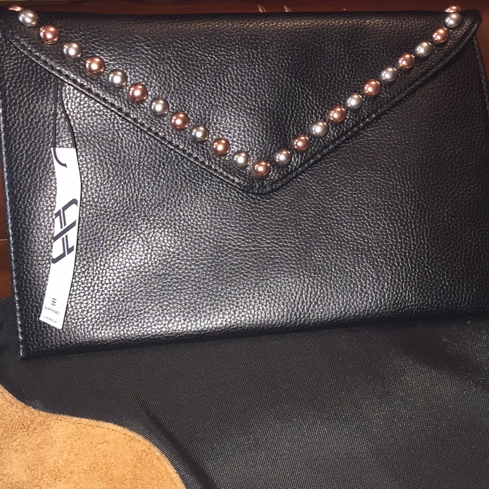 Too cute clutch with grommets